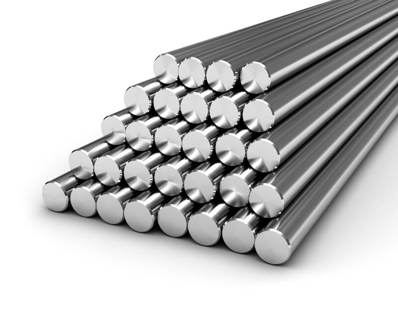 Stack of shiny stainless steel rods arranged in a pyramid shape.